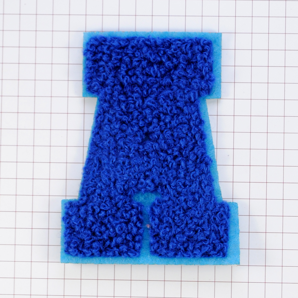 Нашивка махр. А буква синяя, син.фон. 55*72мм, шт. Нашивка Махровая