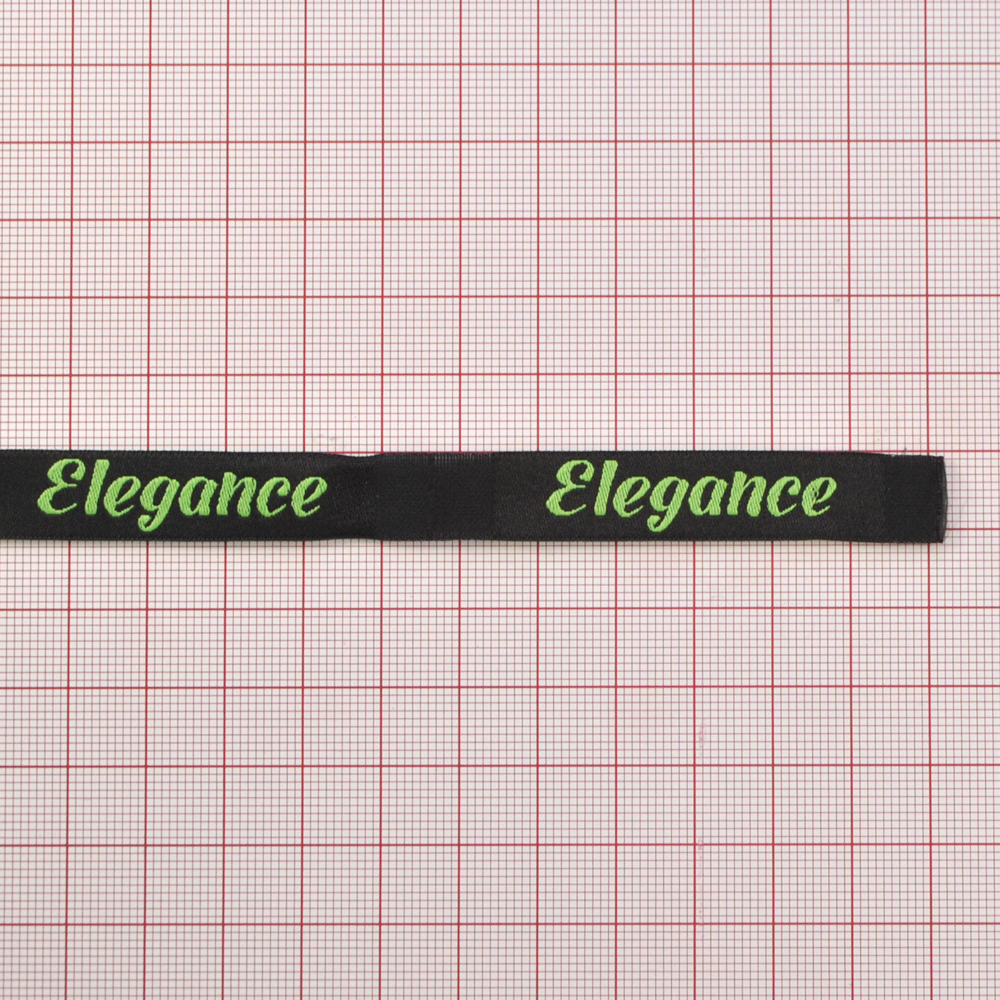 Этикетка тканевая вышитая Elegance №13, 1,2*6,6см черная, зеленый лого /70 atki/ . Вышивка / этикетка тканевая
