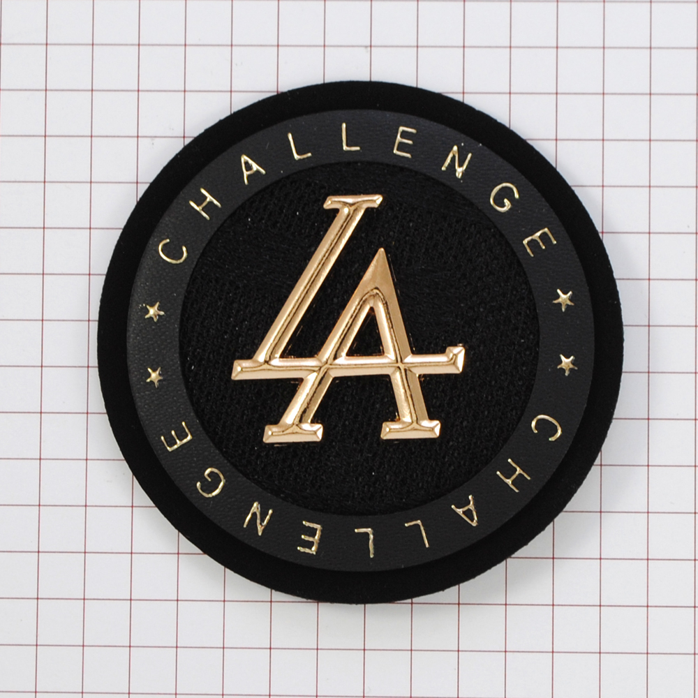 Лейба кожзам с текстилем LA Challenge 57мм, круглая, черная с белым + мет. и надпись золото, шт. Лейба Кожзам