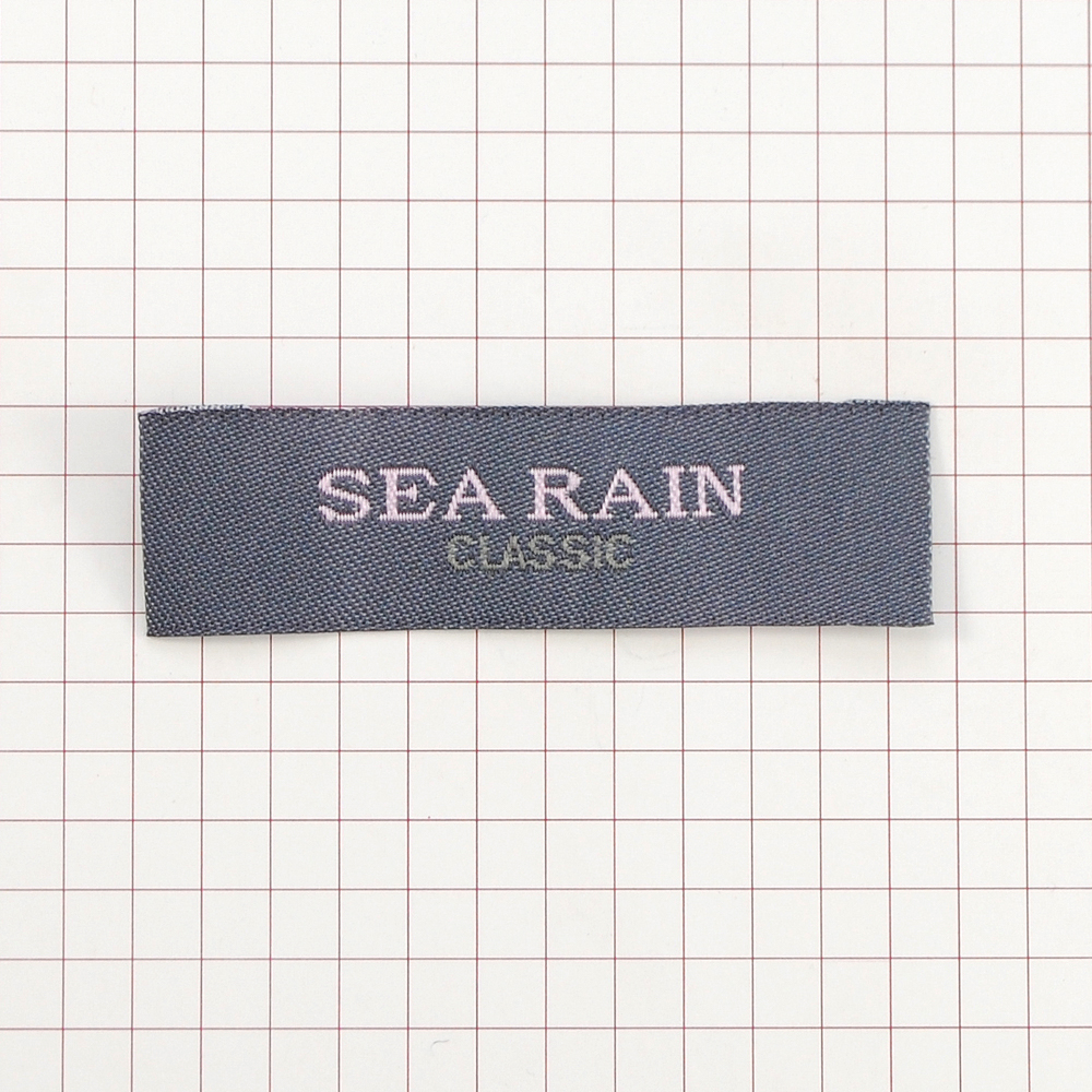 Этикетка тканевая вышитая шт. Sea Rain 1,6см серый, шт. Вышивка / этикетка тканевая