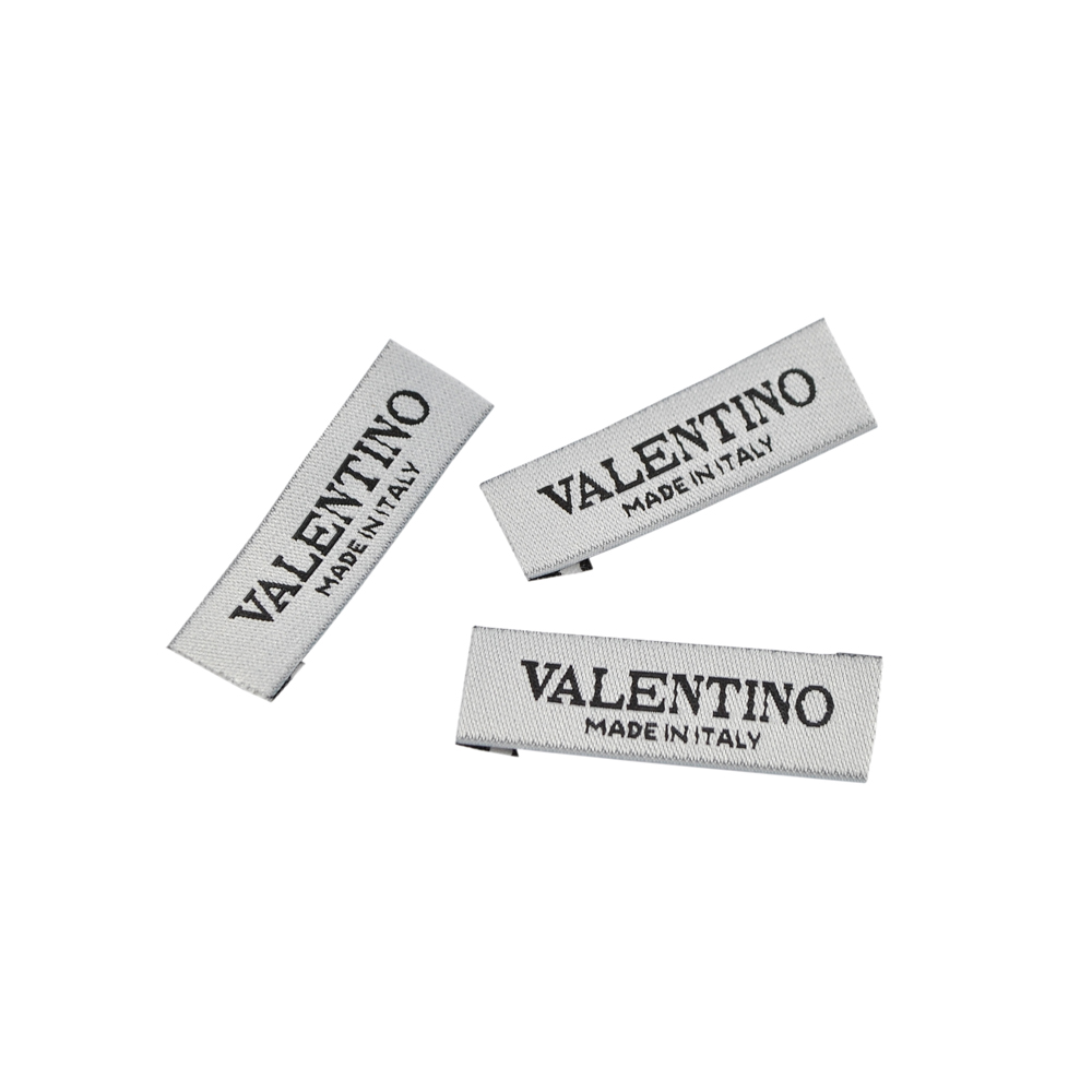 Этикетка тканевая вышитая шт.Valentino (made in Italy) 1,2*4см, белая, черный лого /atkisatin/, шт. Вышивка / этикетка тканевая