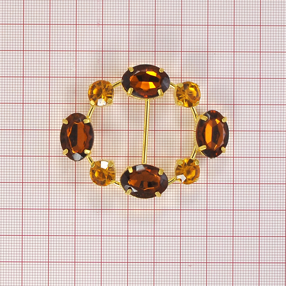 Украшение стеклянное 7009 GOLD пряжка 2,3см овал, 8 крупныых янтарных камней. Перетяжка металл со стразами