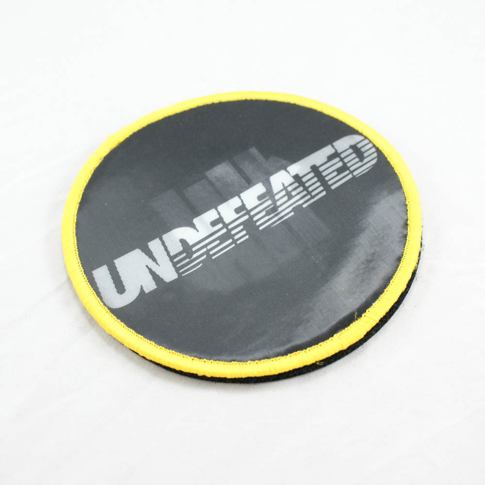 Нашивка тканевая с голограммой 3D на липучке UNDEFEATED 9.5*9,5см круглая, черно-бело-желтая, шт. Нашивка Липучка