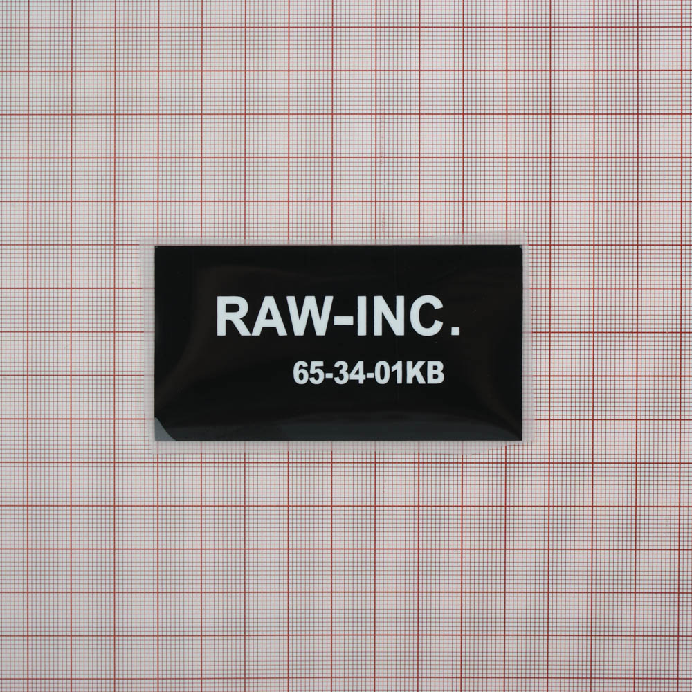 Термоаппликация резиновая RAW-INC 84*45мм черная прямоугольная, белый лого, шт. Термопереводки Резиновые, Термопленка