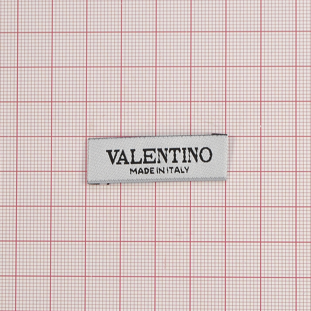 Этикетка тканевая вышитая шт.Valentino (made in Italy) 1,2*4см, белая, черный лого /atkisatin/, шт. Вышивка / этикетка тканевая
