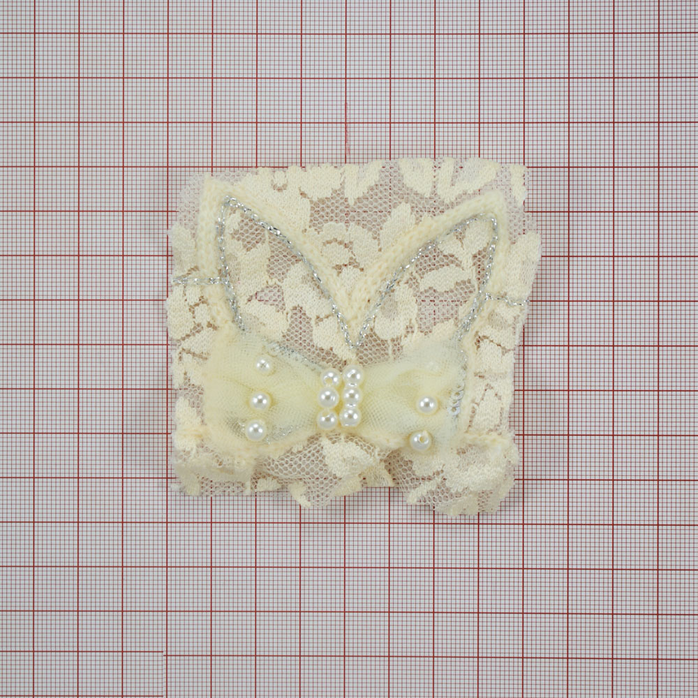 Аппликация кружевнаяпришивная Уши зайца с бантом 6,2*7см бежевый, желтый жемчуг, люрекс серебро, шт. Аппликации Пришивные Кружевные Вязаные