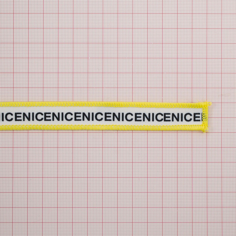 Нашивка тканевая NICE лента 26,5*1,8см белая, черный, желтый оверлок, шт. Нашивка Вышивка, Ткань