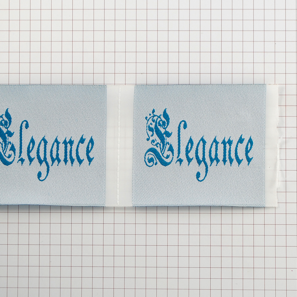 Этикетка тканевая вышитая Elegance №12а бело-голубой 6см// . Вышивка / этикетка тканевая