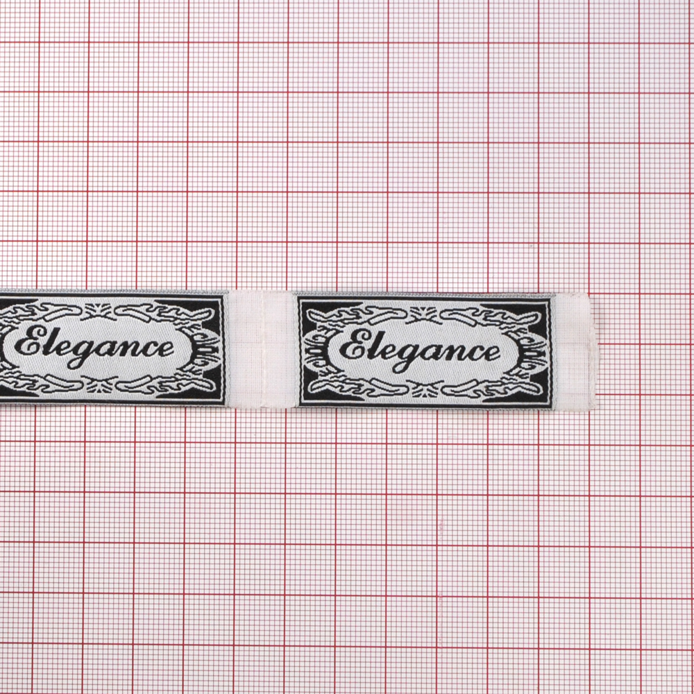 Этикетка тканевая вышитая Elegance № 2, 6,3*2,3см черный на белом /tafta/. Вышивка / этикетка тканевая