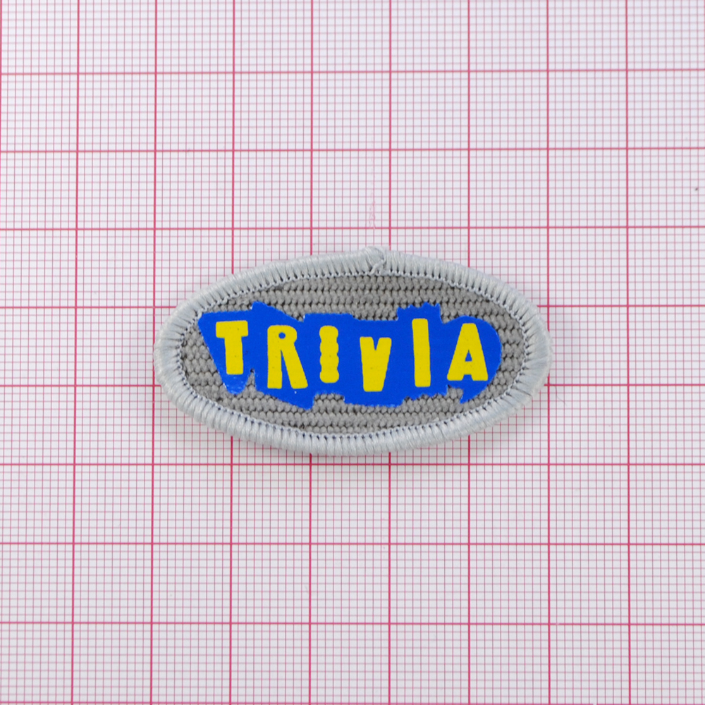 Лейба ткань Trivia, овал, 5*2,6см, серый, жёлтый, синий, шт. Лейба Ткань