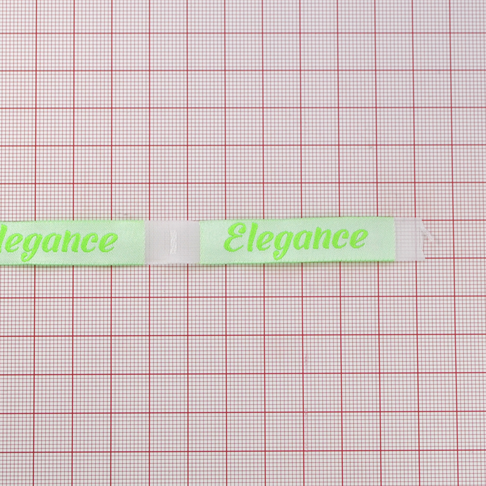 Этикетка тканевая вышитая Elegance №13, 1,2*6,6см белая, зеленый лого /70 atki/ . Вышивка / этикетка тканевая