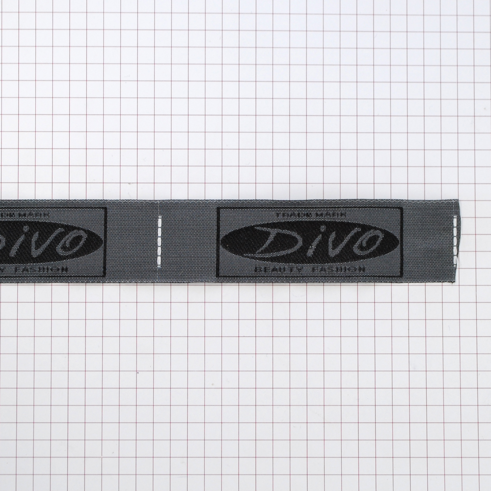 Этикетка тканевая вышитая Divo черно-белая 2.5см, 100м. Вышивка / этикетка тканевая