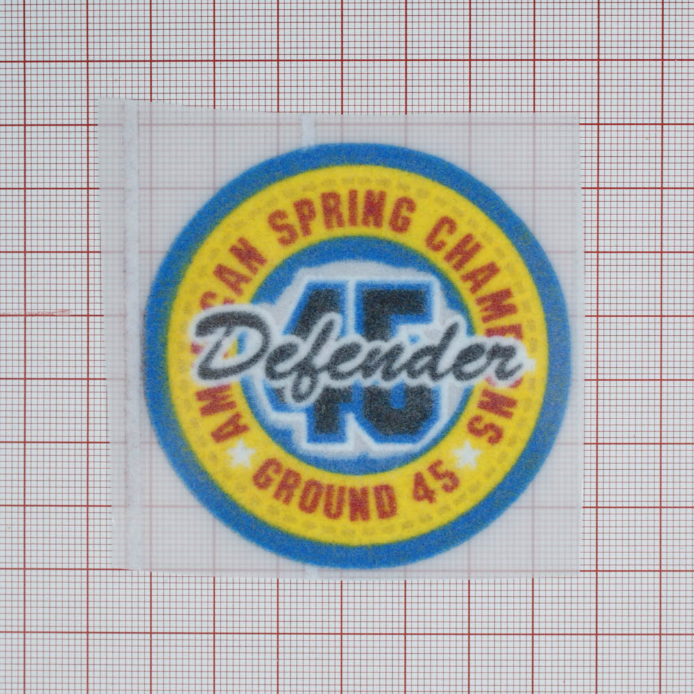 Термоаппликация флок Defender 45, 70*70мм, круглая, синий, желтый, красная надпись по кругу, шт. Термоаппликации Флок, Войлок
