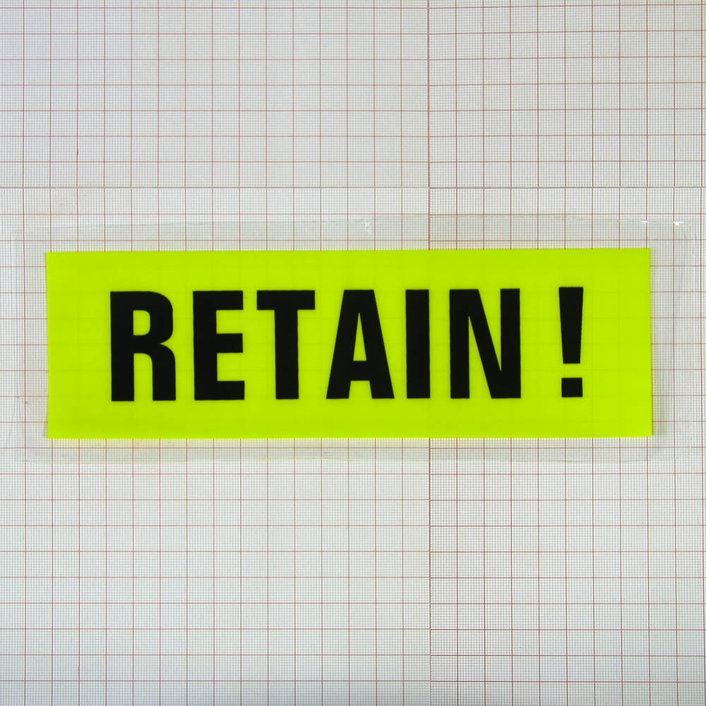 Аппликация клеенка пришивная Retain 25*9см прозрачная, желтый фон, черный текст, шт. Аппликации Пришивные Резина, Силикон