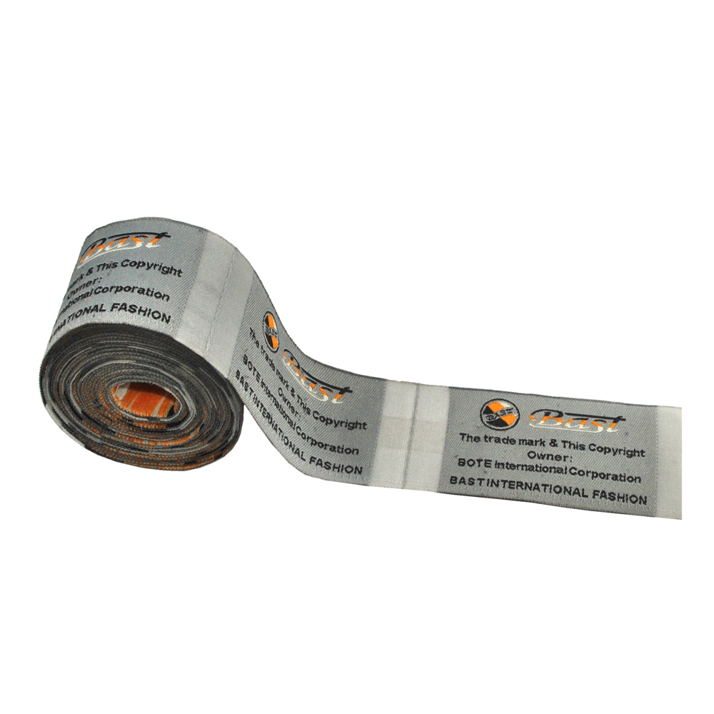 Этикетка тканевая вышитая Bast 4см серая, 100м. Вышивка / этикетка тканевая