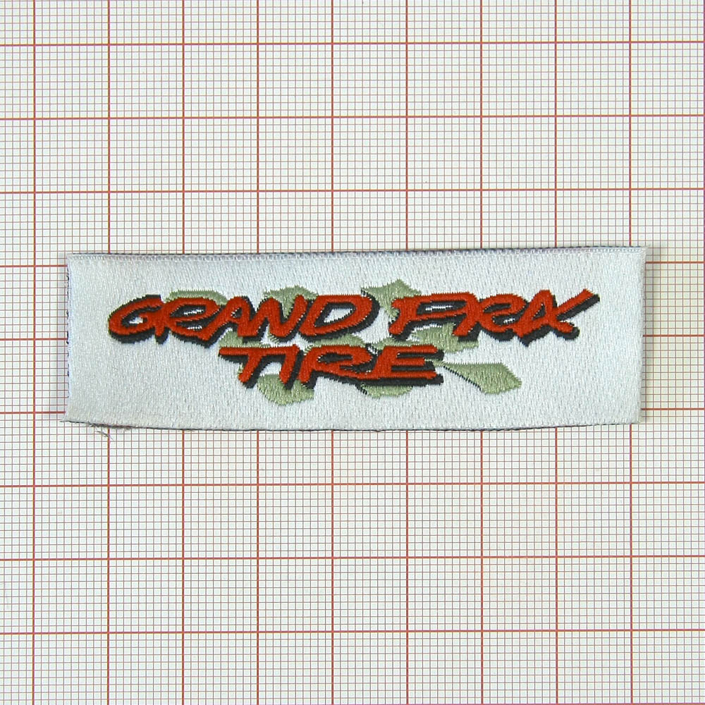 Нашивка Grand Prix Tire 8,5*2,5см, белая. Шеврон Нашивка