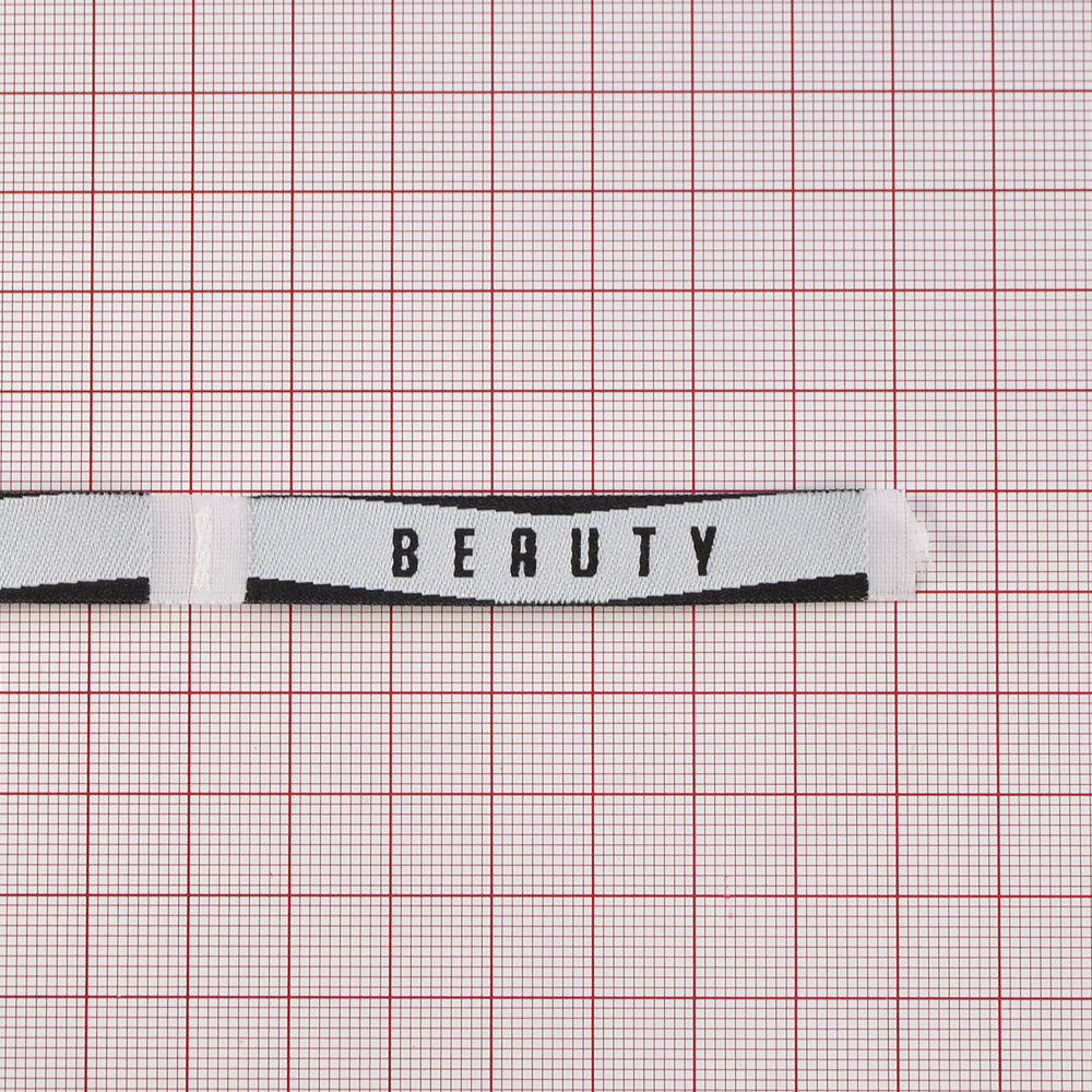 Этикетка тканевая вышитая BEAUTY 1,2*7,0см, черно-белая, шт. Вышивка / этикетка тканевая