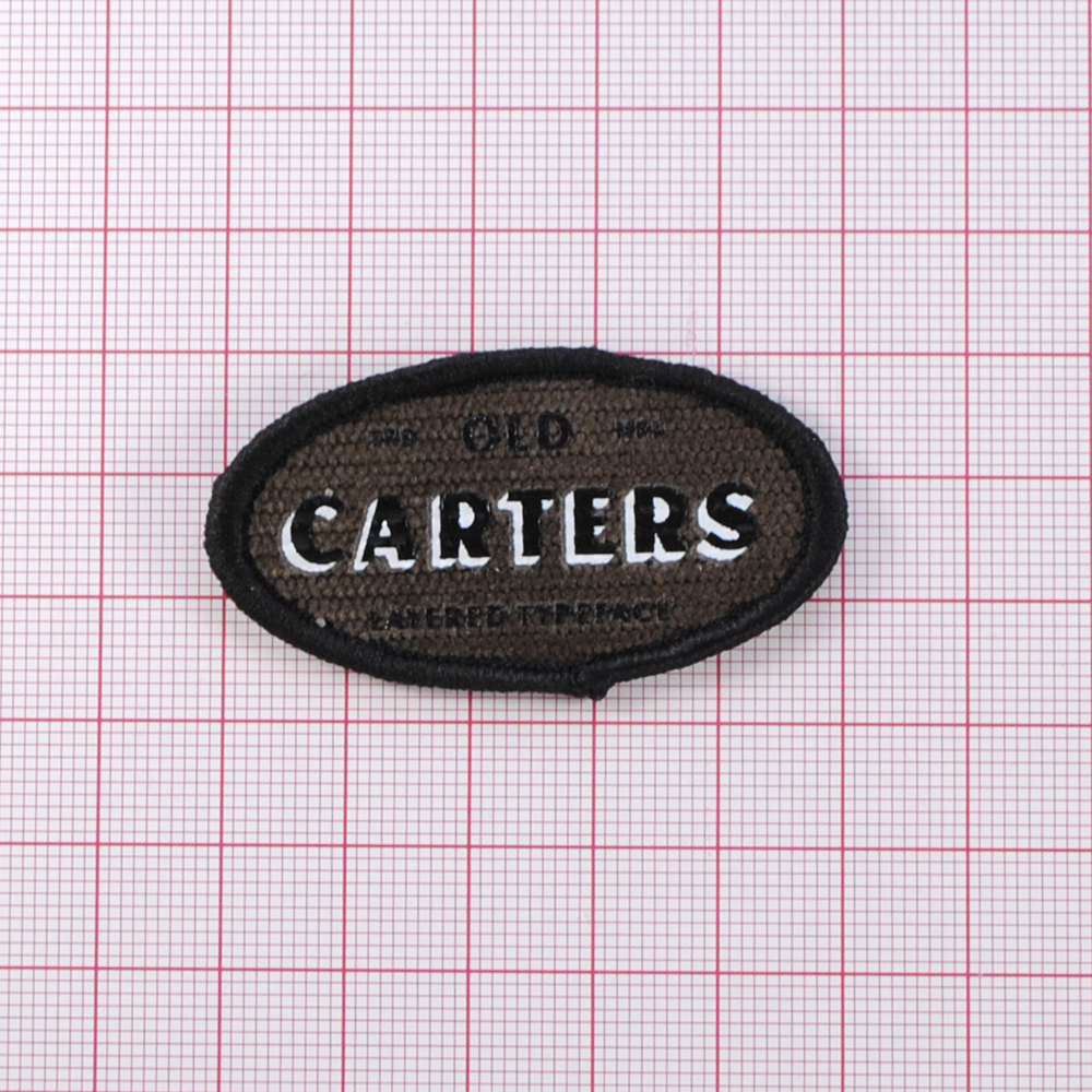 Лейба ткань., Carters овал, 5*2,7см., коричн., черн., бел., шт. Лейба Ткань