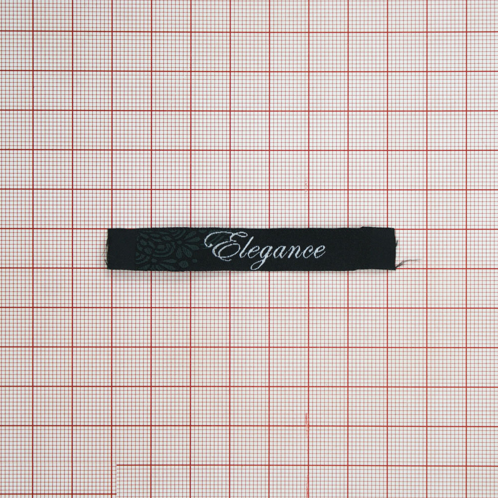 Этикетка тканевая вышитая Elegance №14, 1,2*7,6см, черно-белая с цветочным орнаментом /70 atki/ . Вышивка / этикетка тканевая