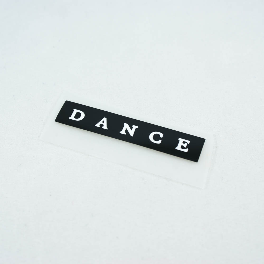 Термоаппликация резиновая DANCE 55*11мм черная прямоугольная, белый лого, шт. Термопереводки Резиновые, Термопленка