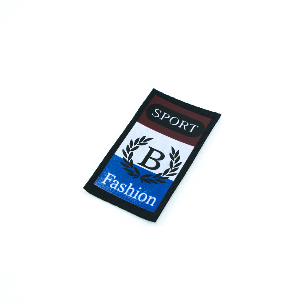 Нашивка тканевая накатанная B Sport Fashion 6,7*3,5см черная рамка, черно-бело-сине-красный рисунок, шт. Нашивка Вышивка