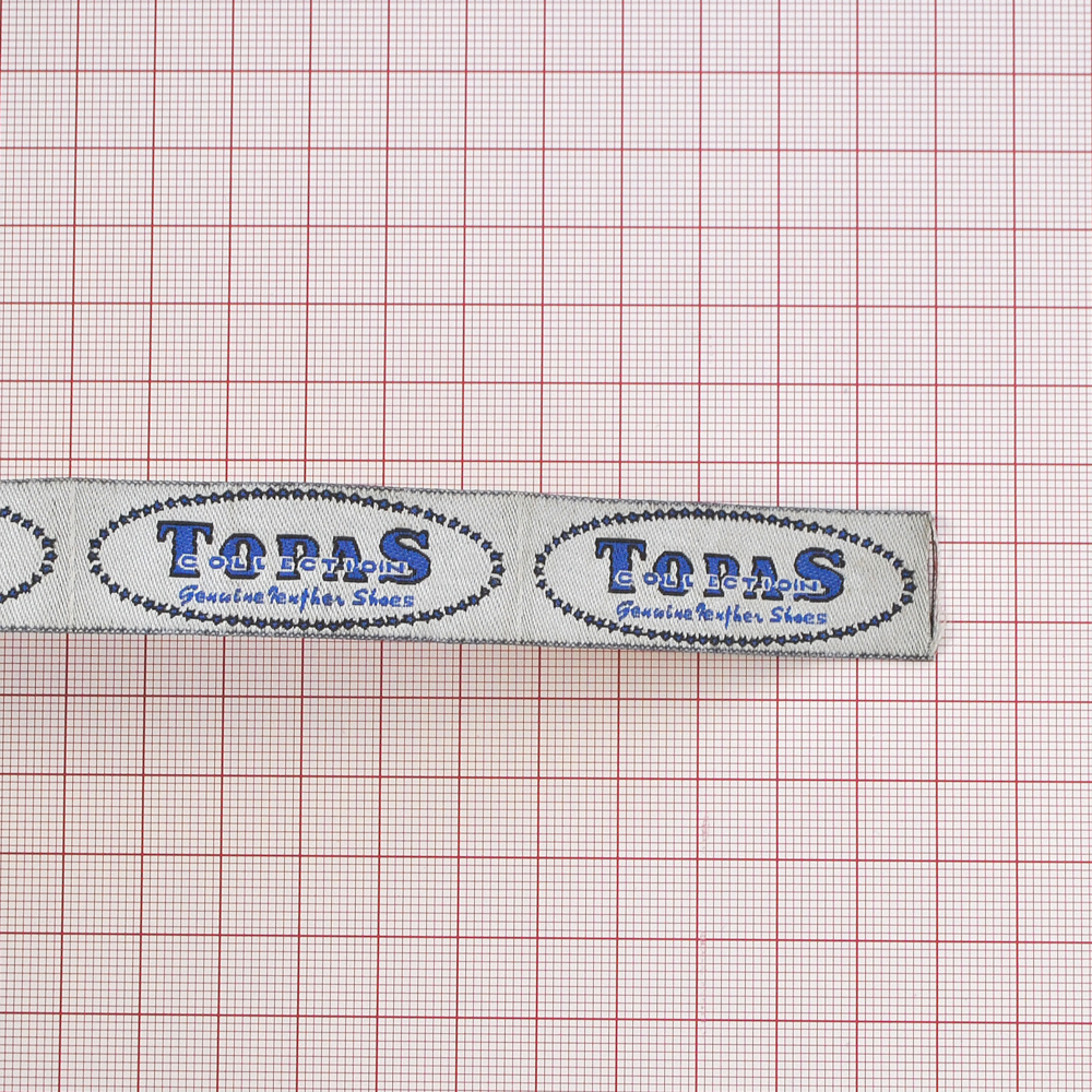 Этикетка тканевая вышитая Topas /клей/ 5,4*1,9см. Вышивка / этикетка тканевая