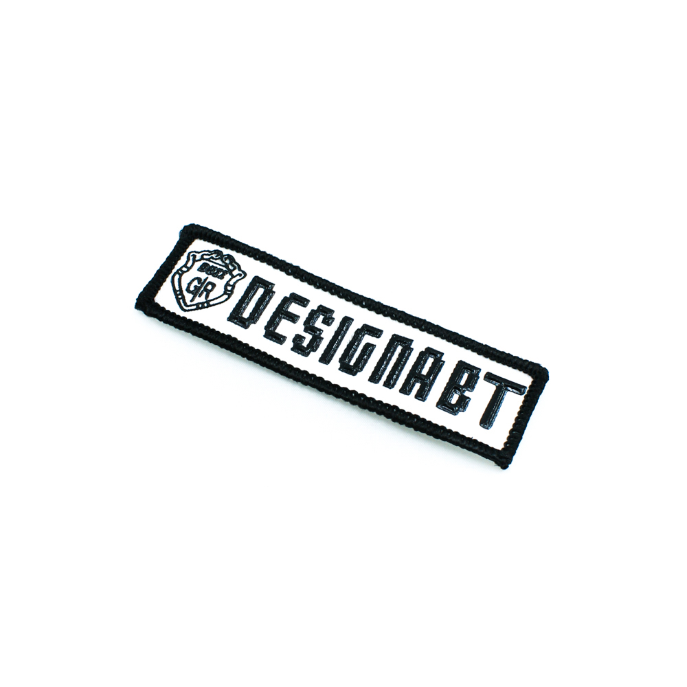 Нашивка тканевая Designabt 9,8*3см, бело-черная. Нашивка Резиновый Конгрев