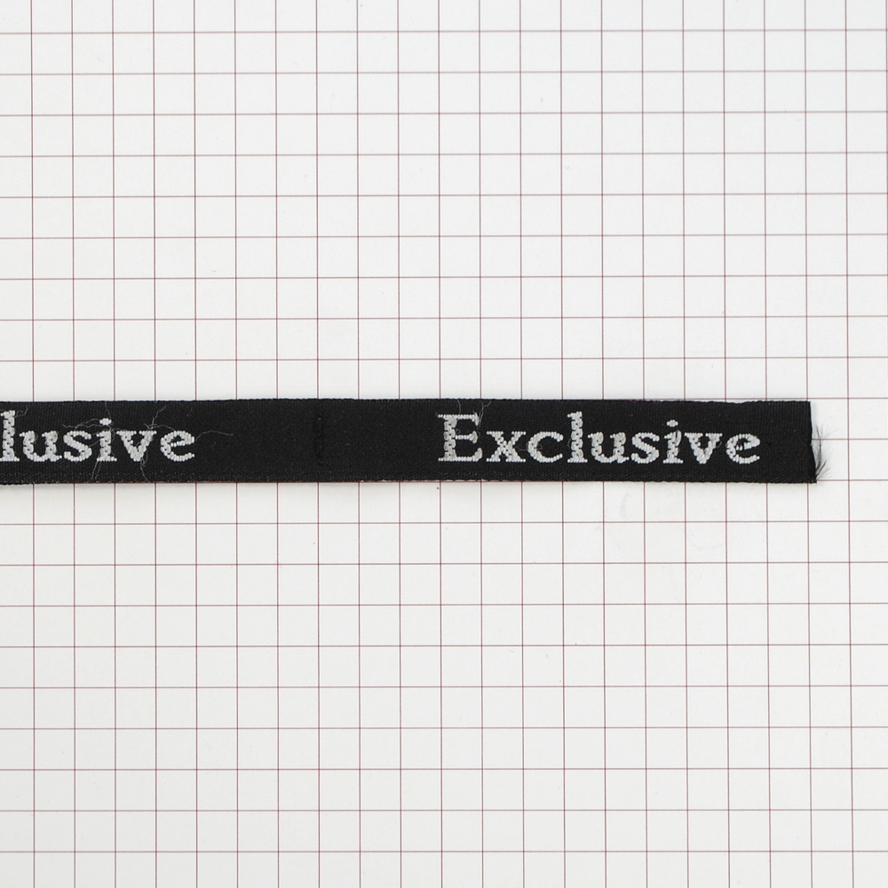 Этикетка тканевая вышитая Exclusive №6, 7,2*1,0см черно-белая /tafta/. Вышивка / этикетка тканевая